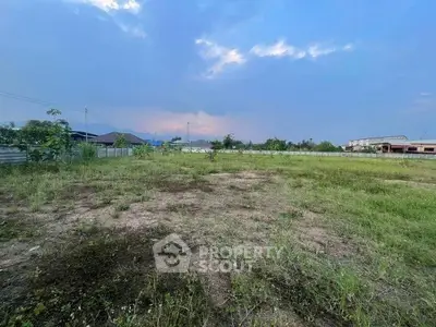 Expansive vacant land with potential for development, surrounded by scenic views and open skies.