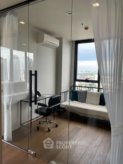 Modern study room with glass walls, city view, and stylish furniture in a high-rise apartment.