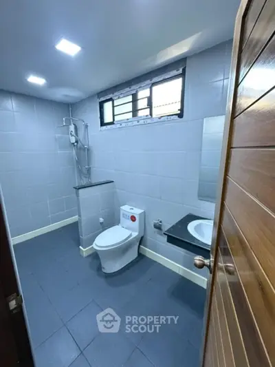 Modern bathroom with sleek tiles and contemporary fixtures