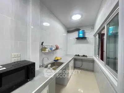 Modern kitchen with sleek countertops and gas stove in a stylish apartment