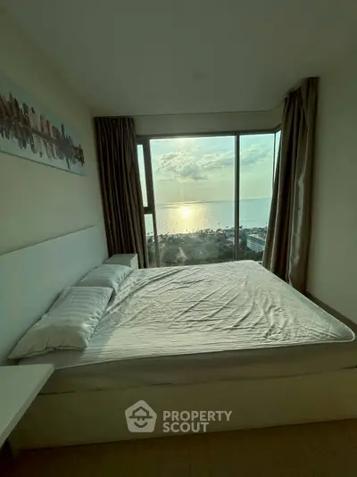 Stunning bedroom with panoramic ocean view and modern decor