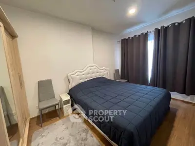 Spacious bedroom with elegant bed and modern decor, perfect for relaxation and comfort.