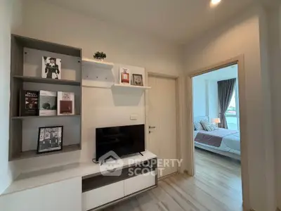 Modern apartment interior with stylish living area and cozy bedroom view.