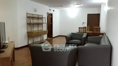 Spacious living room with modern furniture and wooden flooring