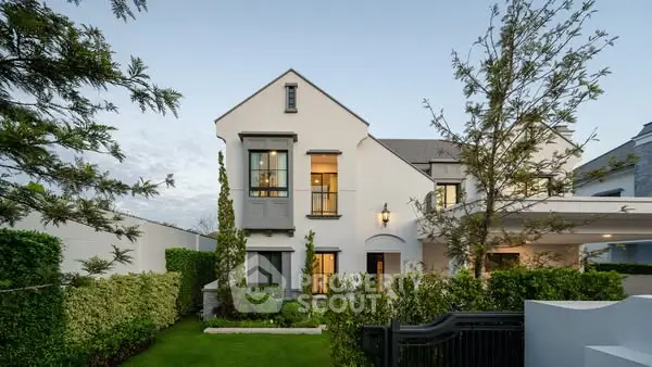 Elegant two-story home with manicured garden and modern architecture