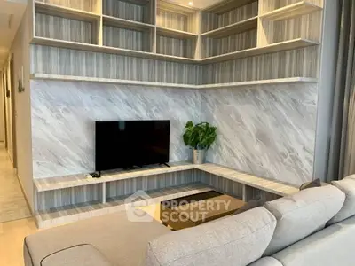 Modern living room with stylish shelving and sleek TV setup