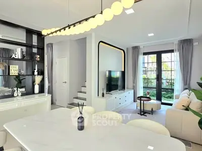 Modern living room with elegant decor and large windows for natural light