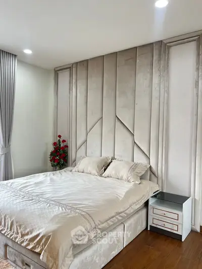 Luxurious bedroom with elegant decor and plush bedding in modern apartment