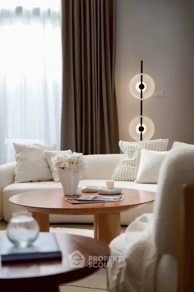 Elegant living room with modern decor and cozy seating area.