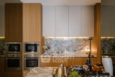 Modern kitchen with sleek appliances and elegant marble countertops