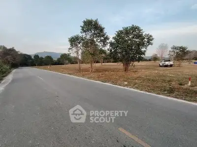 Scenic open land with road access and mountain views, ideal for development or investment.