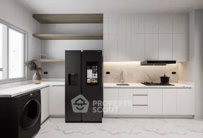 Modern kitchen with sleek appliances and marble countertops in a stylish open layout.