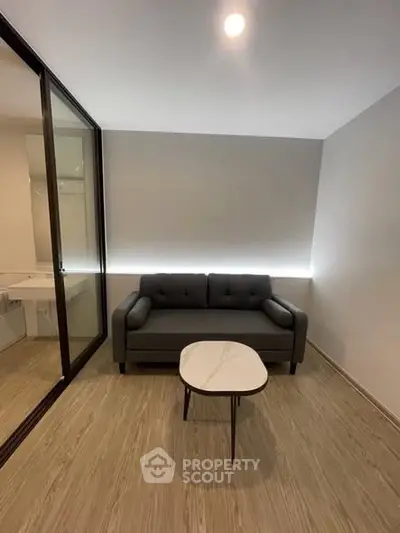 Modern minimalist living room with sleek sofa and elegant coffee table