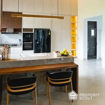 Luxurious modern kitchen with sleek design and elegant dining area