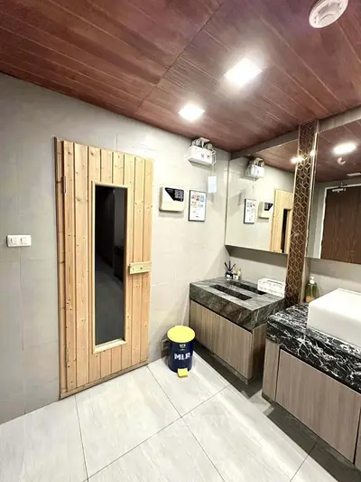 Luxurious bathroom with sauna and modern vanity in upscale property