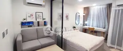 Modern studio apartment with cozy bedroom and stylish decor