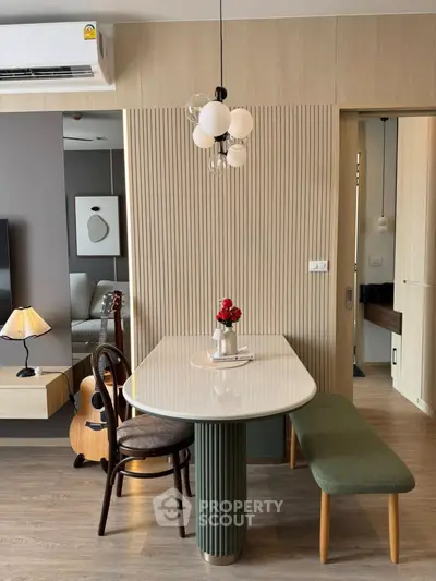 Stylish modern living room with elegant dining area and chic decor