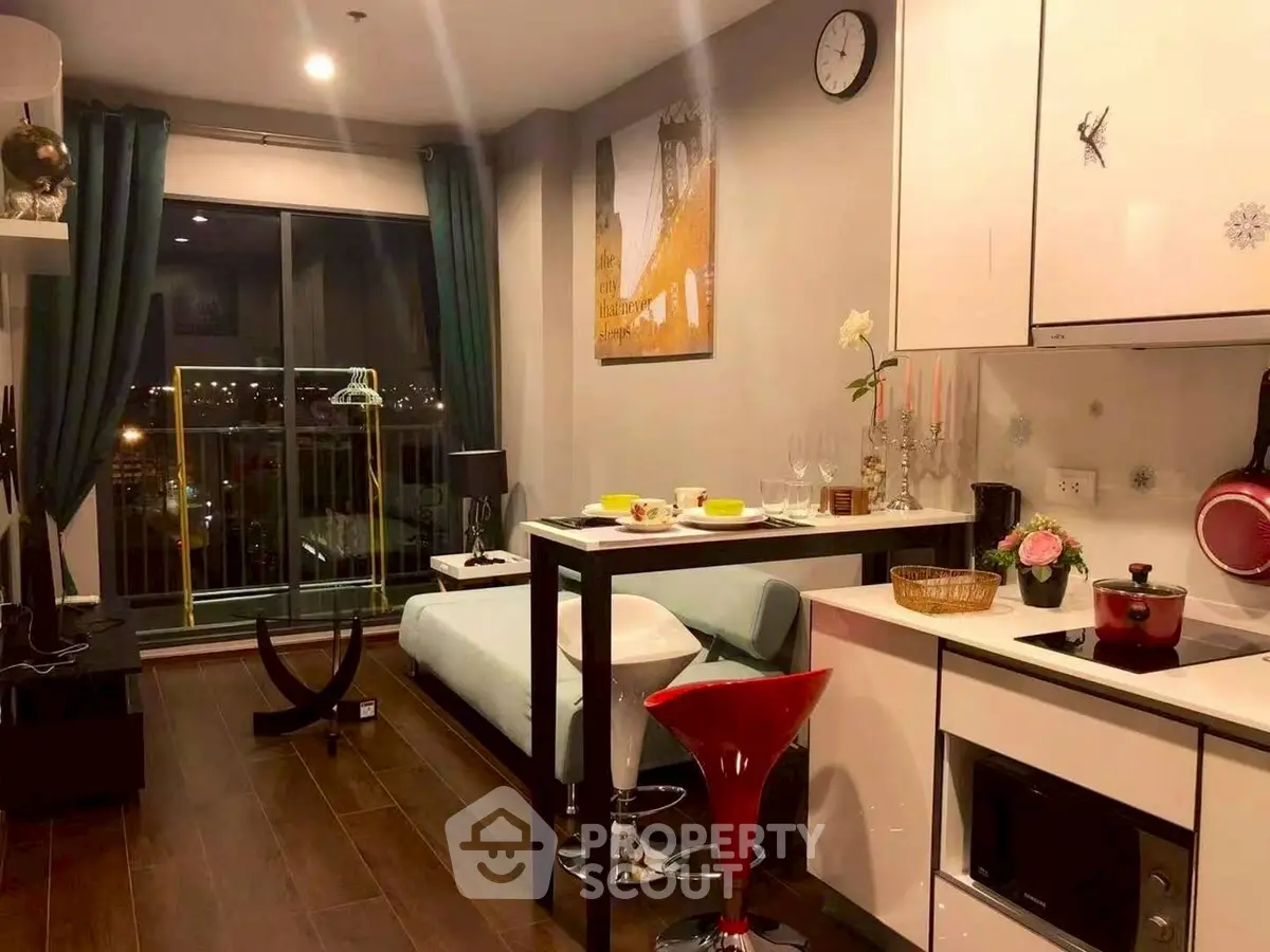 Modern studio apartment with stylish kitchen and cozy living area