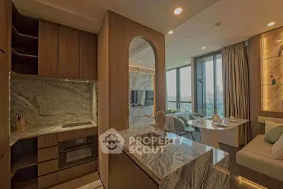 Luxurious open-layout kitchen with marble countertops and modern dining area, offering stunning city views.