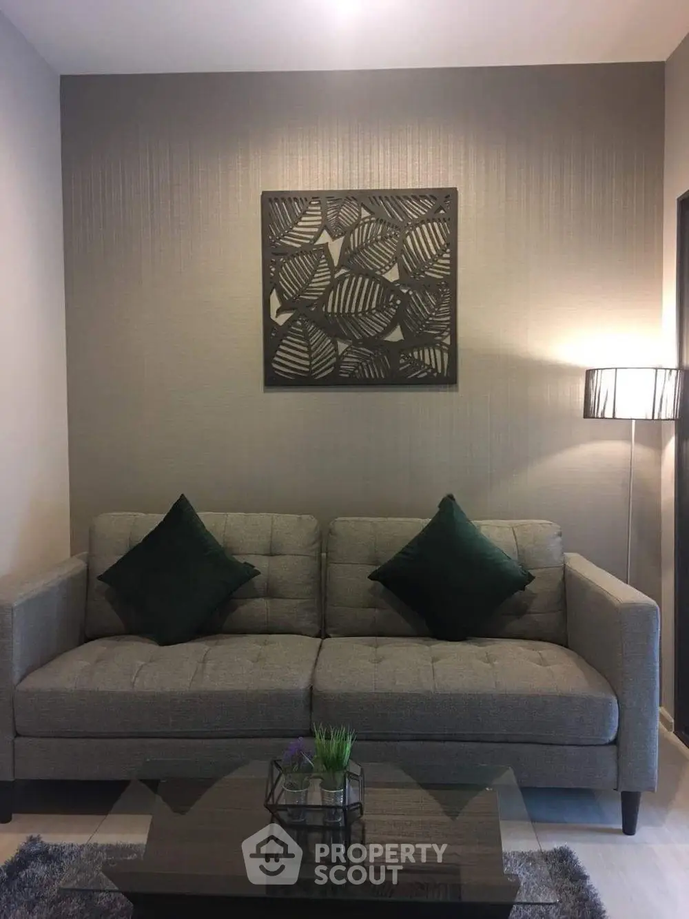 Modern living room with stylish gray sofa and elegant decor