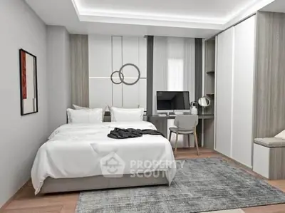 Modern bedroom with stylish decor and workspace, featuring a cozy bed and elegant furnishings.