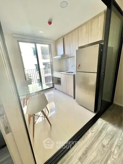 Modern kitchen with sleek appliances and open layout in a bright apartment