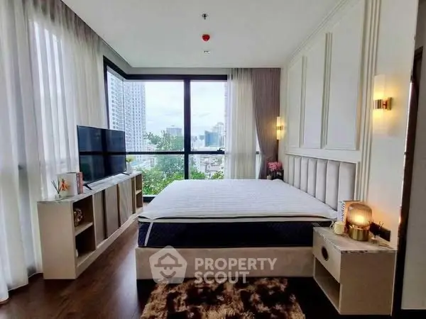 Luxurious bedroom with city view, modern decor, and large windows for natural light.