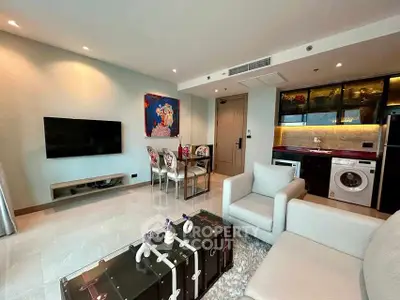Modern living room with stylish decor and integrated kitchen appliances.