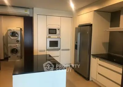 Modern kitchen with sleek appliances and island counter