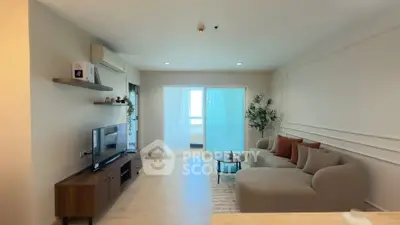 Spacious modern living room with stylish decor and natural light