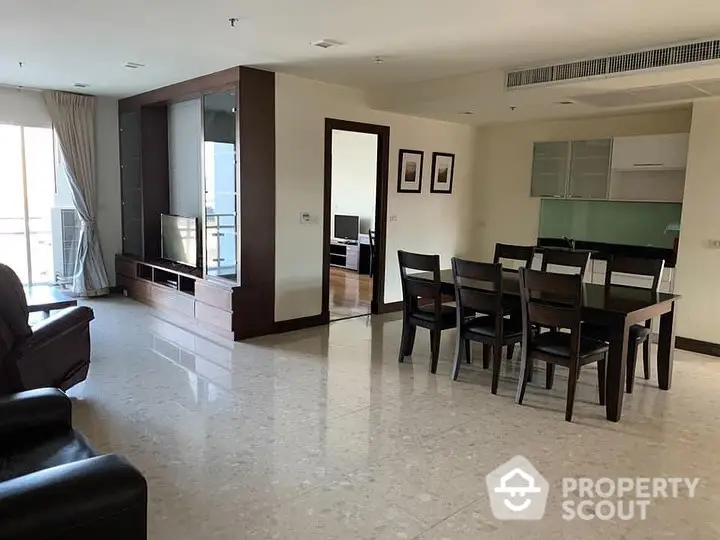 Spacious and elegant living room with polished marble flooring, ample natural light, and modern furniture, perfect for upscale urban living.