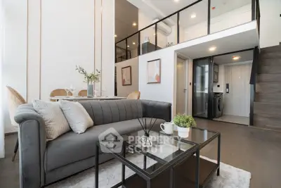 Modern duplex living room with stylish decor and mezzanine level
