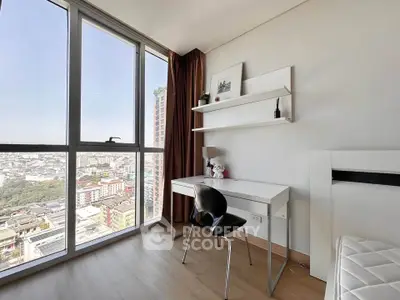 Modern study room with city view, featuring sleek desk and chair, large window, and minimalist decor.