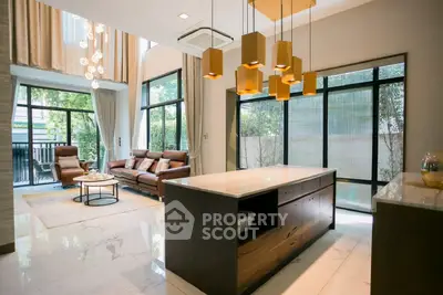 Luxurious modern living room with high ceilings and elegant lighting