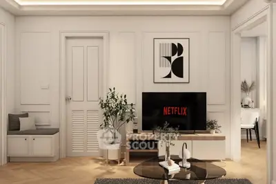Stylish living room with modern decor and Netflix on TV, perfect for relaxation.