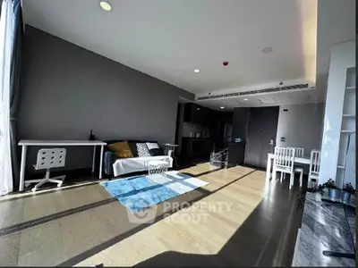 Spacious modern living room with natural light and stylish decor