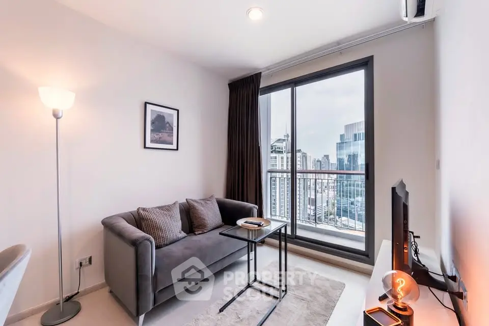 Modern living room with city view, cozy sofa, and sleek decor