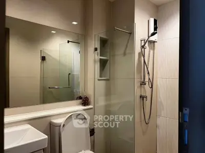 Modern bathroom with glass shower and sleek fixtures