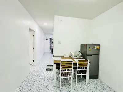 Bright minimalist kitchen with dining area and modern appliances