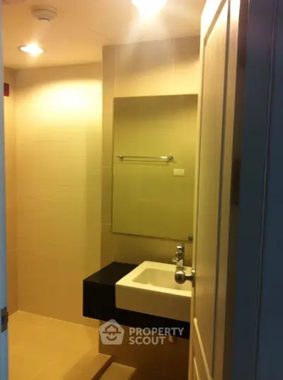Modern bathroom with sleek sink and mirror in a stylish apartment