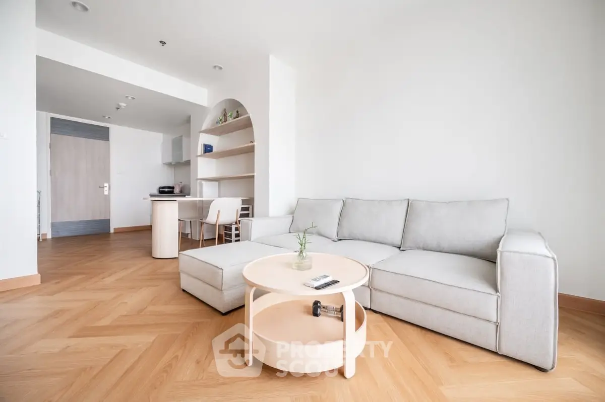 Modern living room with stylish furniture and open layout in a bright apartment.