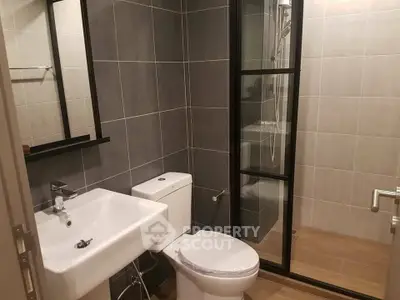 Modern bathroom with sleek design and glass shower enclosure