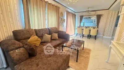 Luxurious living room with elegant decor and plush seating in a stylish home.
