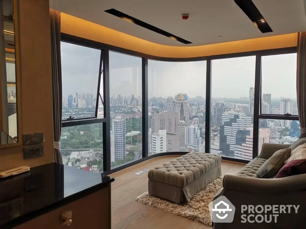 Luxurious high-rise living room with panoramic city views and elegant furnishings.