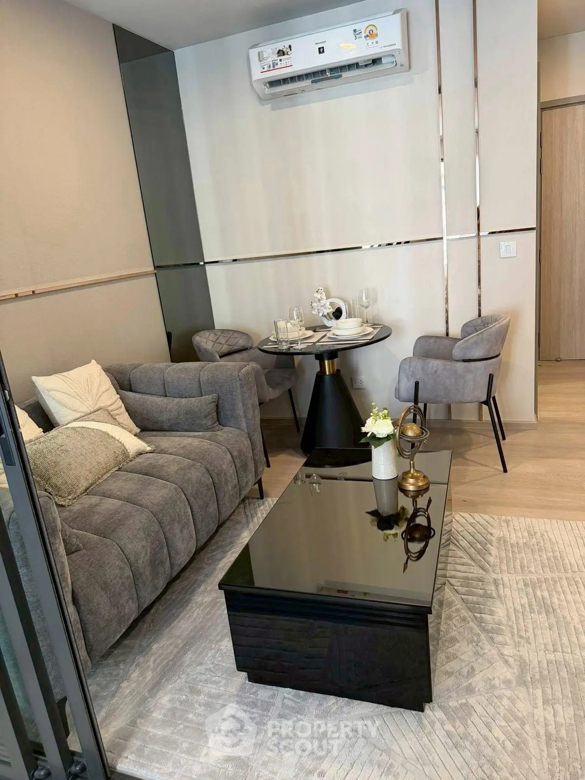 Stylish modern living room with plush gray sofa and elegant decor