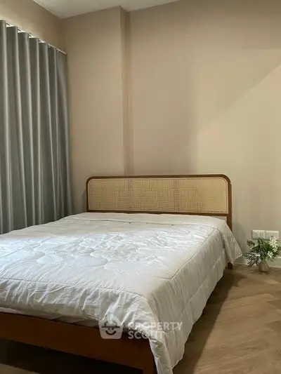 Cozy bedroom with elegant bed and soft lighting, perfect for relaxation and comfort.