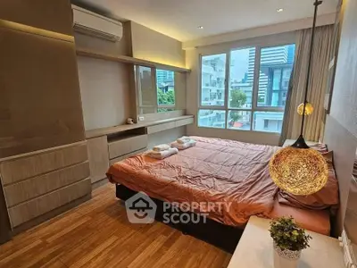 Modern bedroom with large windows and stylish lighting in urban apartment