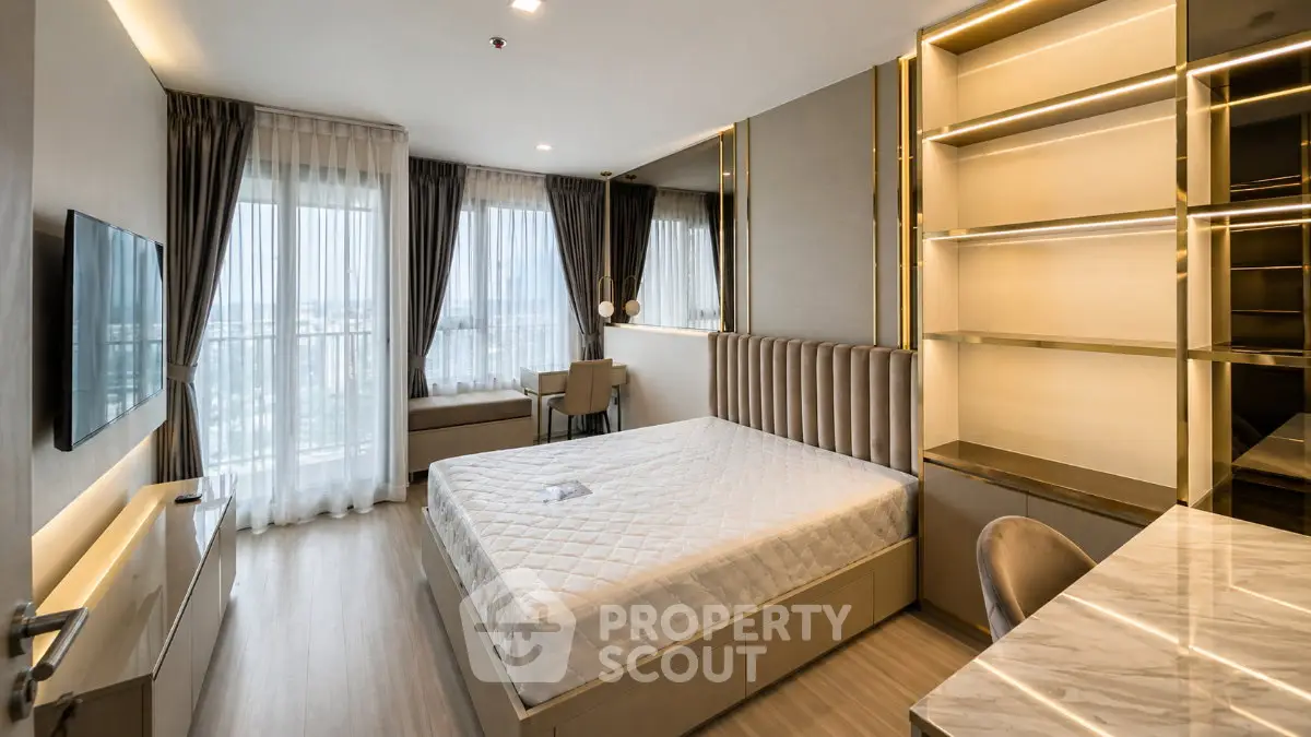 Luxurious modern bedroom with panoramic city view and elegant furnishings.