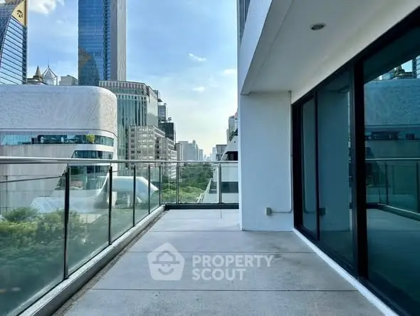 Spacious balcony with city skyline view in modern high-rise building