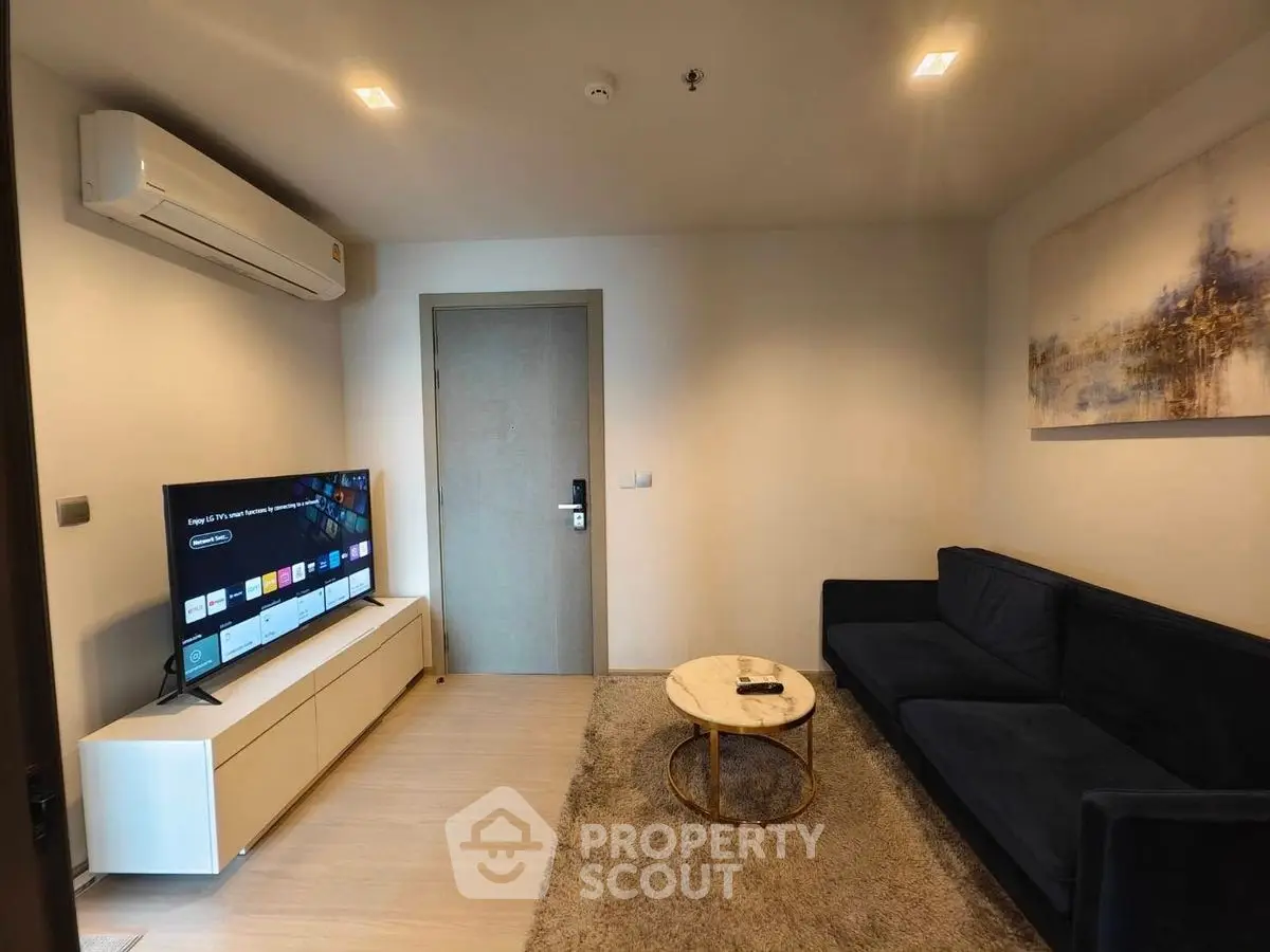Modern living room with sleek TV setup and stylish furniture